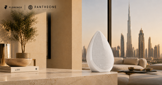 Pantheone Obsidian wireless speaker on a marble console with Dubai's Burj Khalifa skyline in the background, Florence x Pantheone