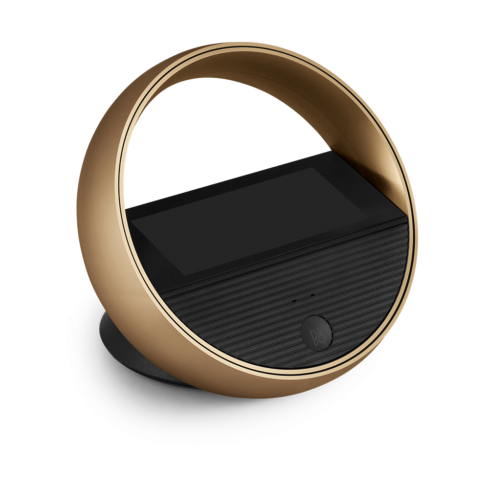 Beoremote Halo in Gold Tone on a table stand
