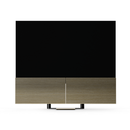 Beovision Harmony 83-inch OLED TV in Gold Tone with Light Oak speaker covers